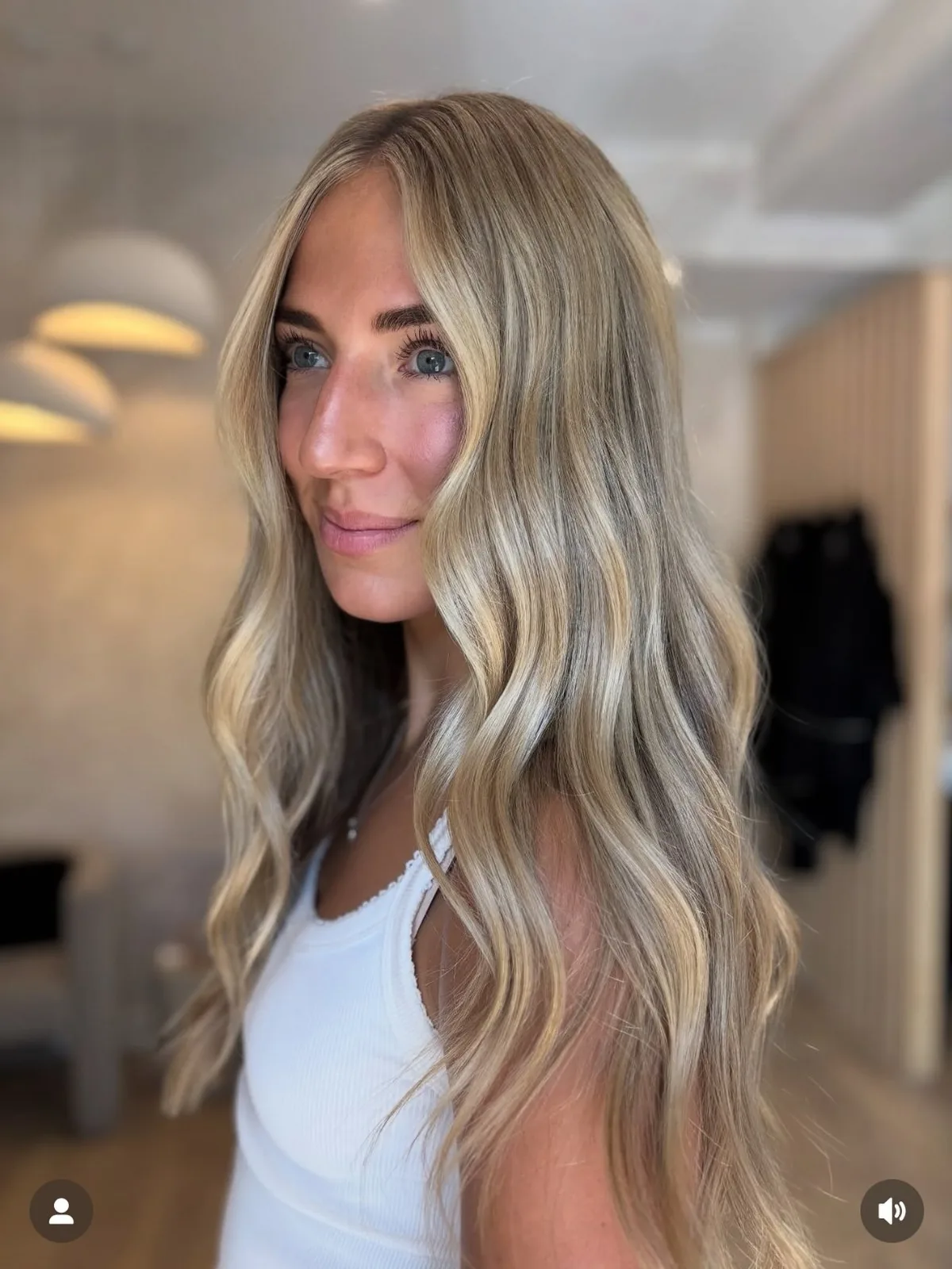 Bright, blended blonde with soft waves, by Carly