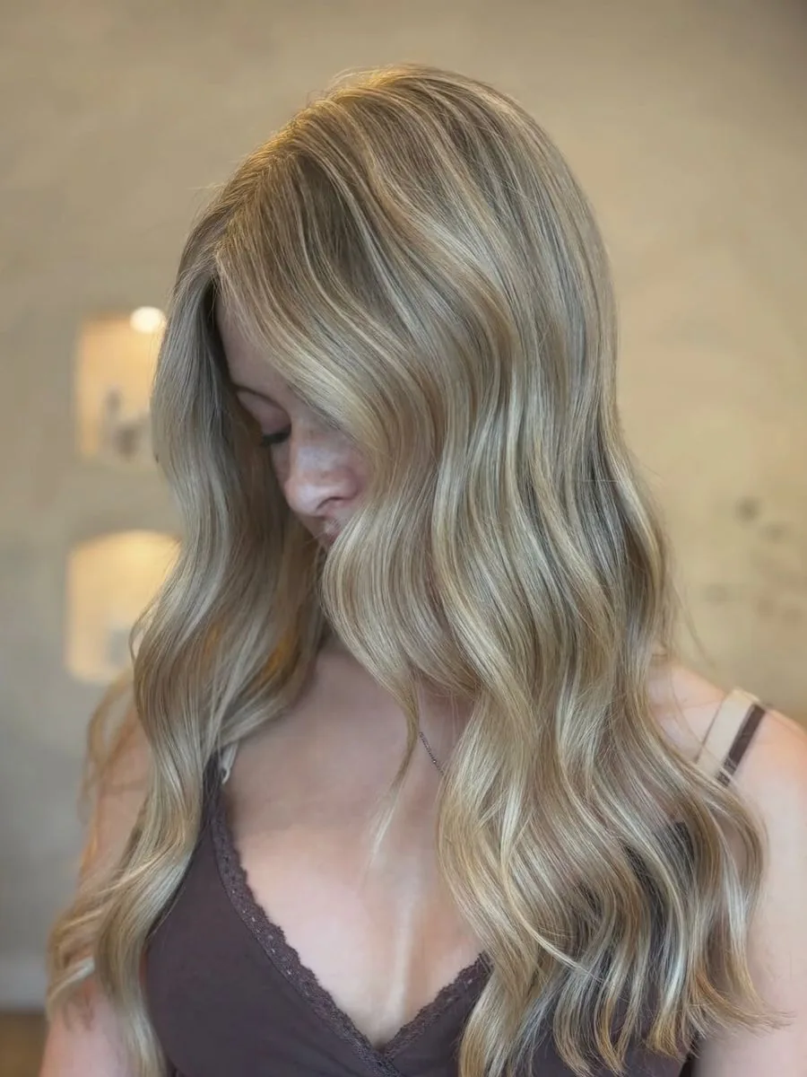 Bright blonde with a soft root, by Carly
