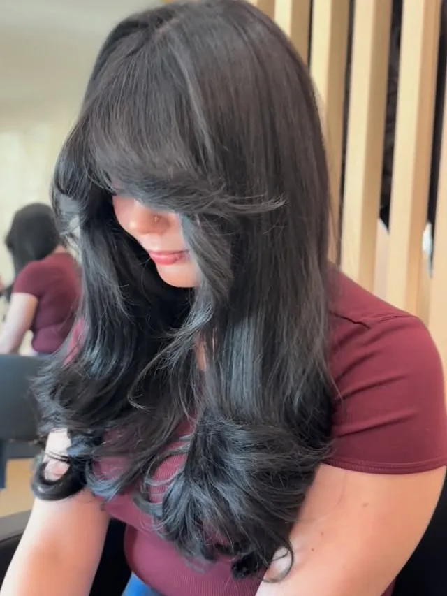 Dark brunette with a layered blowout, by Angela