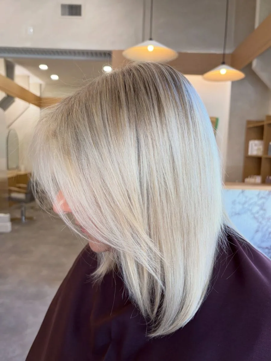 Smooth blonde lob, the first colour in the Winnipeg salon, by Tanessa